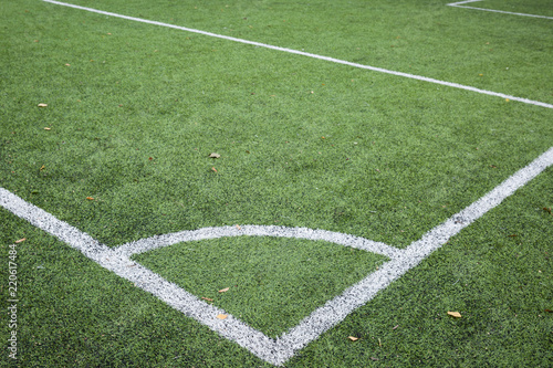 Closeup of Corner kick line of football and soccer field, background texture © goodmoments