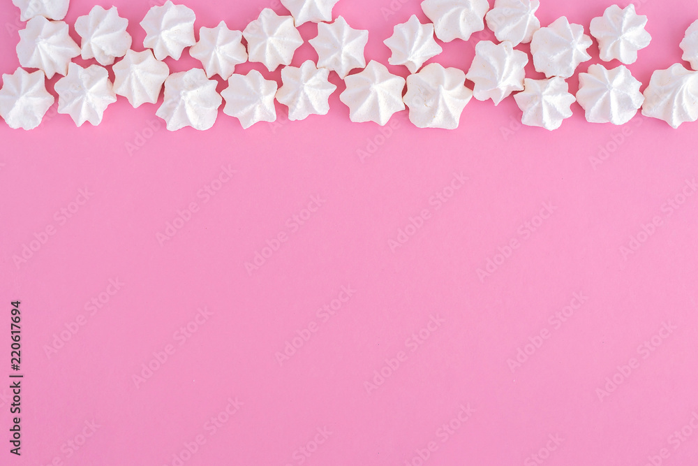 White meringues on pink background, pattern
