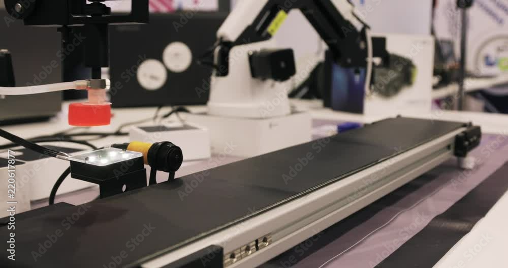 Modern Industrial automation. Robotic Arm Assembling products Modern Industrial automation. Robotic Arm Assembling products