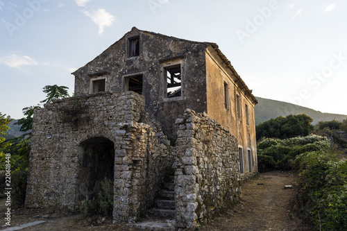 Old abandoned stone-built house in Old Perithia at Pantokrator Mountain, Corfu Island, Greece photo