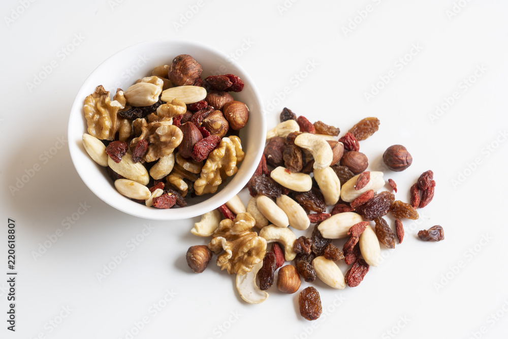 a bowl containing dried fruit a bowl containing dried fruit