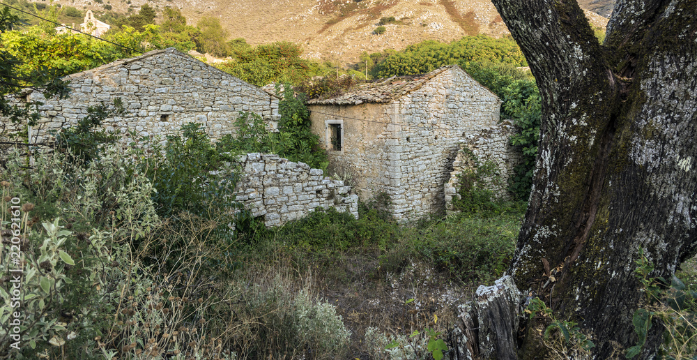 Old abandoned stone-built house in Old Perithia at Pantokrator Mountain, Corfu Island, Greece
