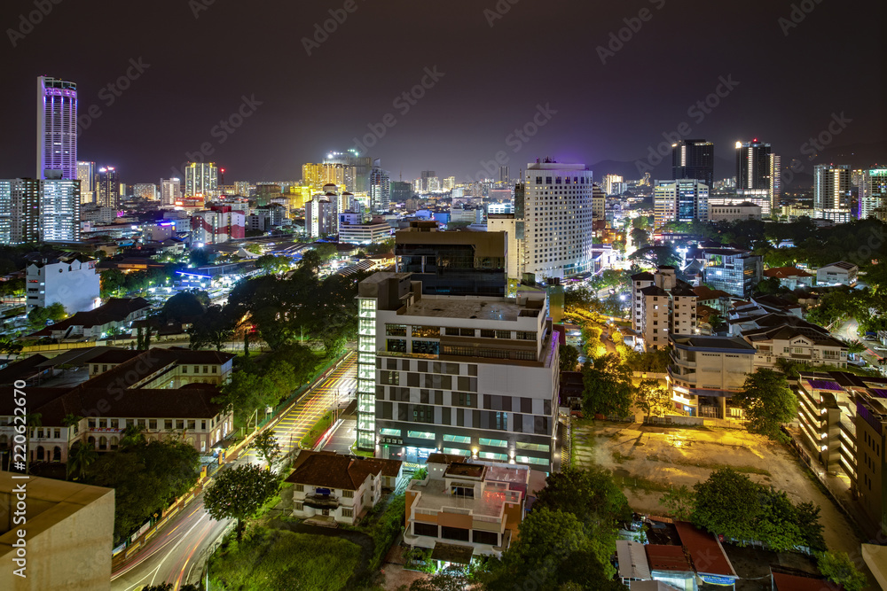 Aerial night panorama view of Penang cityscape with illuminated  building and busy circulation streets