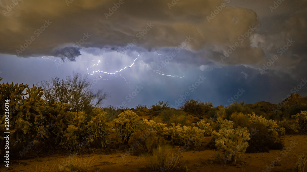 Monsoon storms in the Sonoran desert near Phoenix, Arizona causes lightening, misty, swirling clouds and a stormy look and feel to the desert
