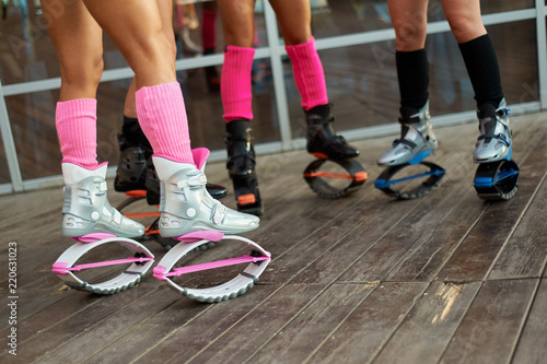 group of womens legs in kangoo jumps boots