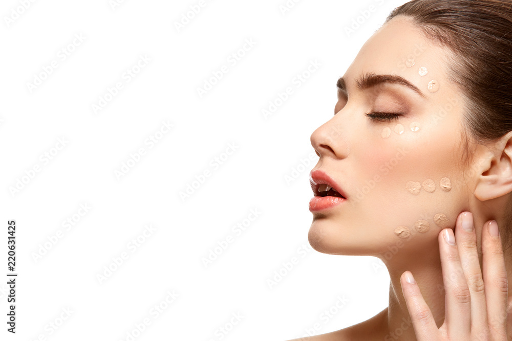 girl applying foundation on face isolated on white girl applying foundation on face isolated on white