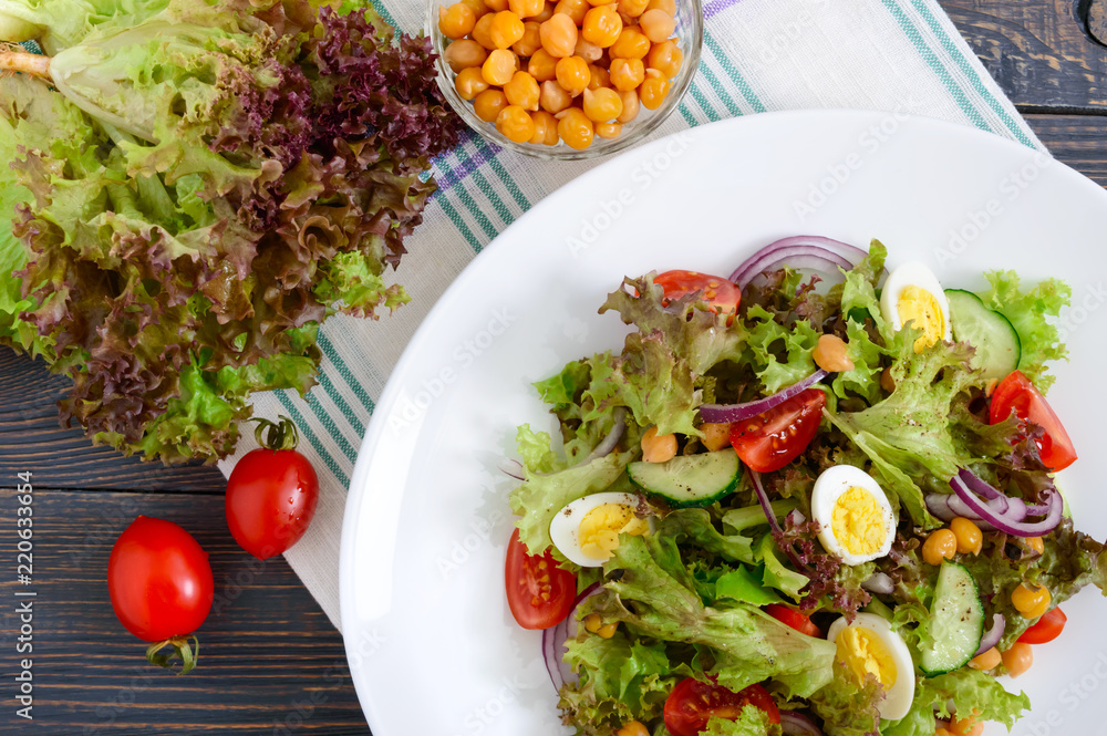 Dietary, vegetarian salad with quail eggs, fresh herbs, chickpeas, red onions and cherry tomatoes. Dietary, vegetarian salad with quail eggs, fresh herbs, chickpeas, red onions and cherry tomatoes.