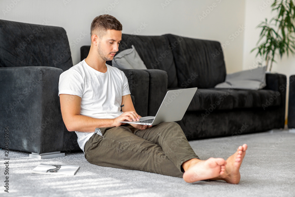 guy freelancer with laptop working at home guy freelancer with laptop working at home