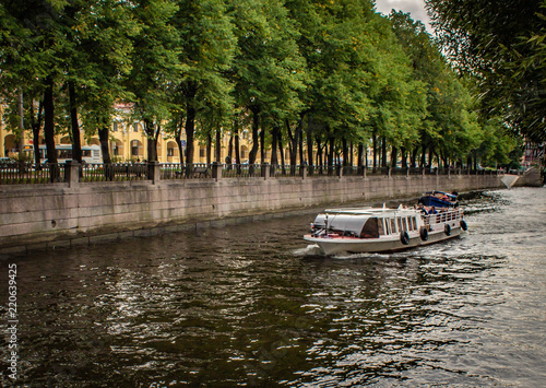 tourist ship sailing on the river channel