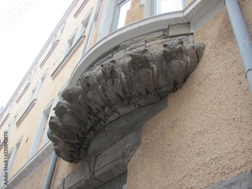 An interesting architectural detail, decorating the building - figures of the owls photo