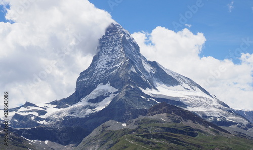 Fame Matterhorn peak in clouds, alpine mountains range landscape in swiss Alps seen from Gornergrat in SWITZERLAND