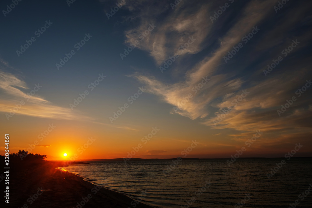 Beautiful sunset over the sandy sea beach Beautiful sunset over the sandy sea beach