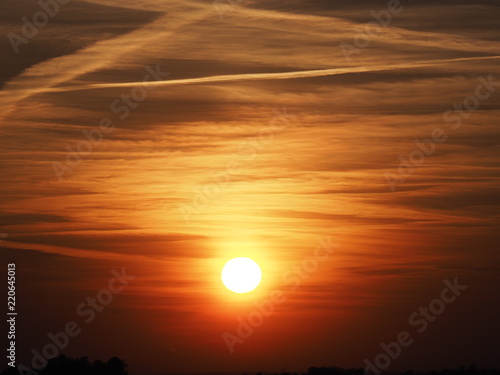 Cool sky at sun set with clouds formation seen in spring evening from european city in Poland