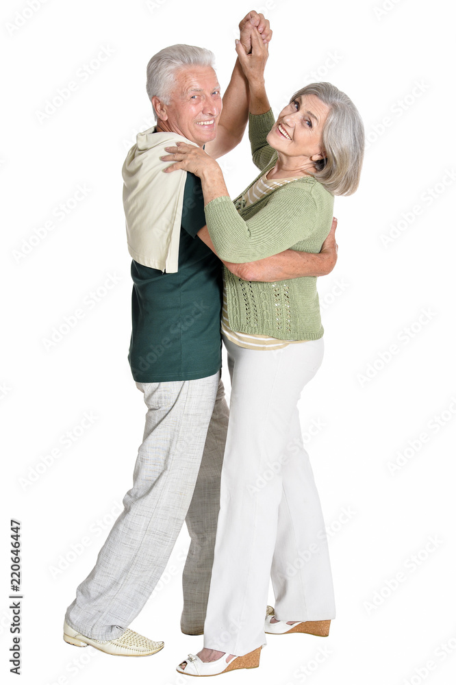 Portrait of a senior couple dancing on white background Portrait of a senior couple dancing on white background