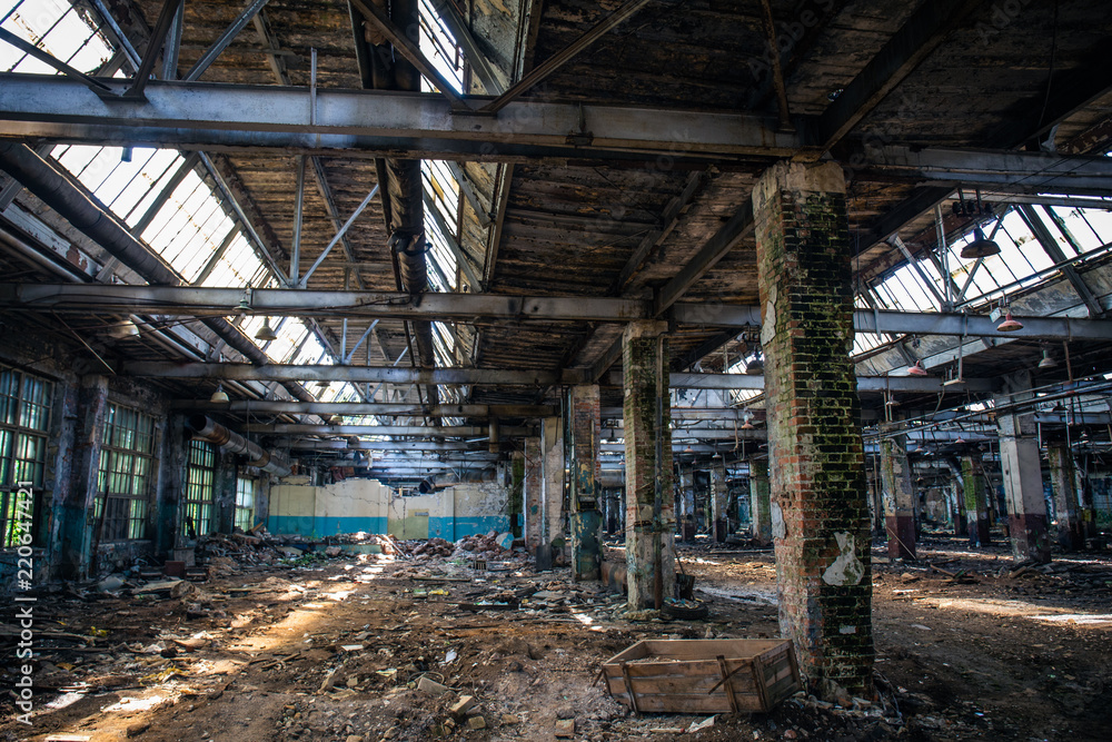 Abandoned ruined industrial warehouse or factory building inside, corridor view with perspective, ruins and demolition concept Abandoned ruined industrial warehouse or factory building inside, corridor view with perspective, ruins and demolition concept