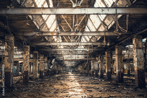 Abandoned ruined industrial warehouse or factory building inside, corridor view Fototapeta