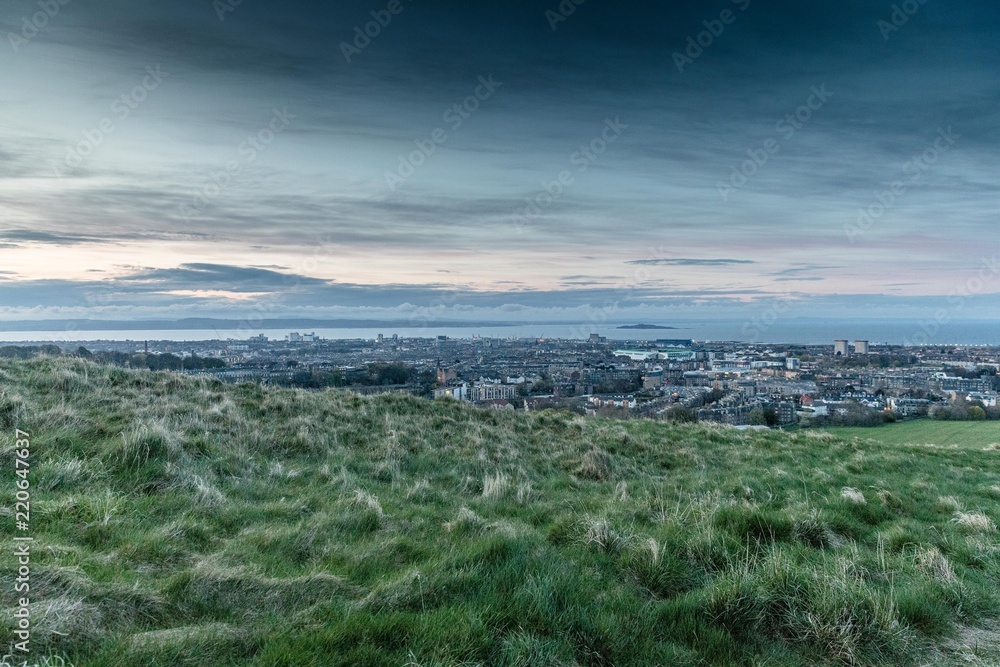 Sunset colours and top view of Edinburgh city from Arthur's Seat in Holyrood Park