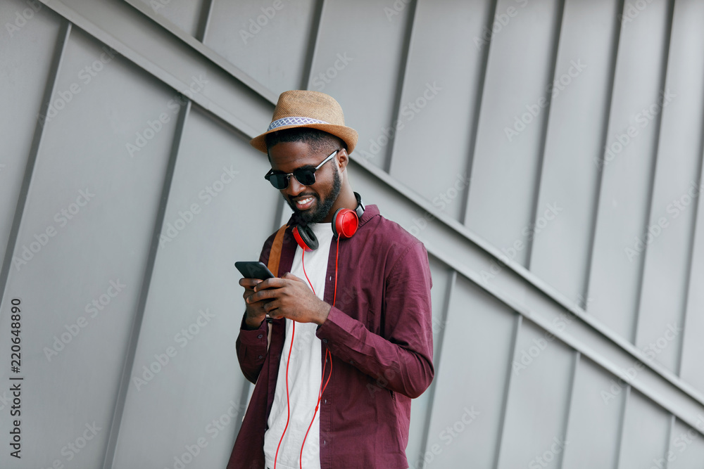 Men Fashion. Man With Phone And Headphones On Street Stock Photo | Adobe  Stock