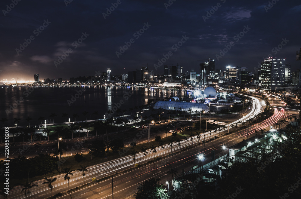 Skyline of capital city Luanda and its seaside during the night, Angola, Africa