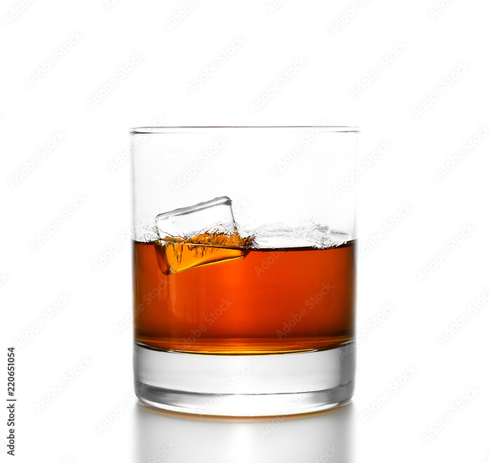 Whisky glass with splashes, isolated on white