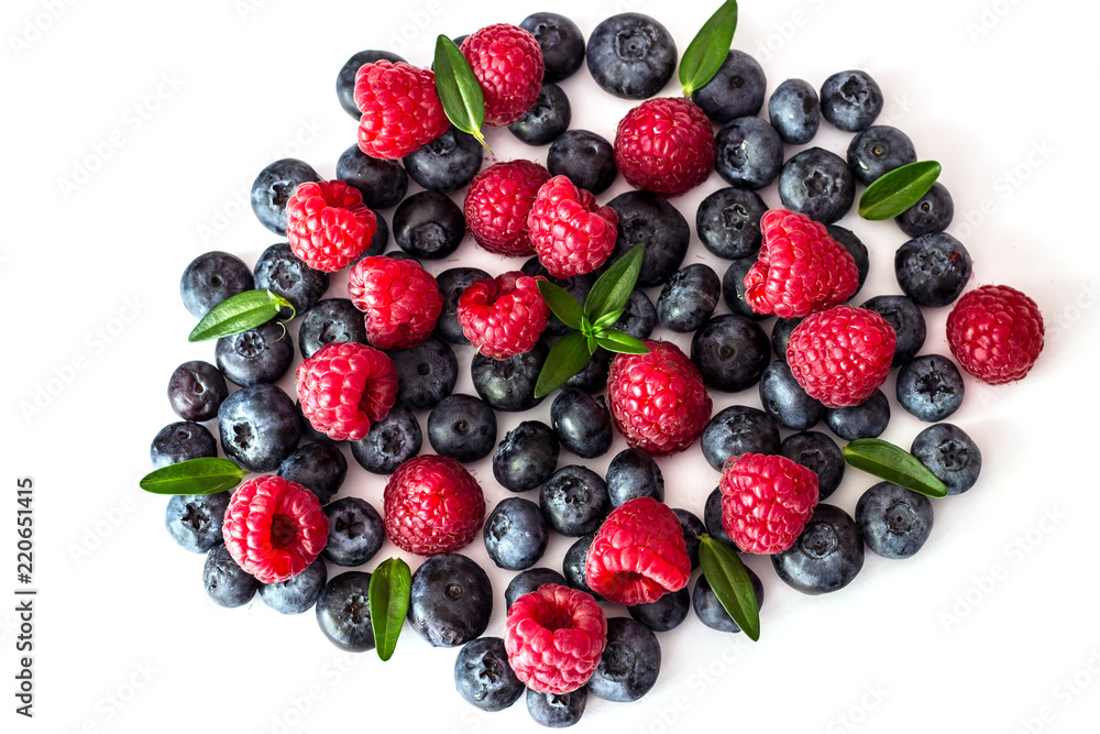 Blueberries and raspberries on white background. Blueberries and raspberries on white background.