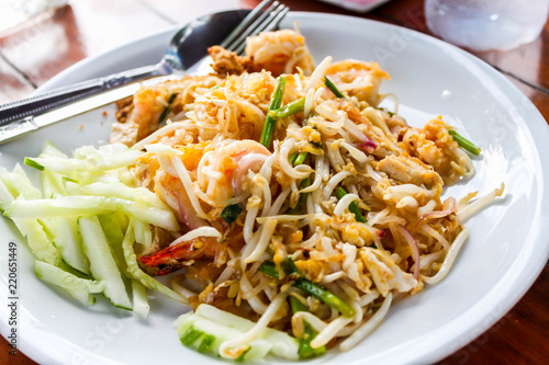 Closeup of Fried noodle Thai style with shrimp or Fried Rice Sticks with Shrimp on white dish