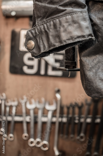 Vintage Motorbike Garage and Workshop with Tools hanging on the wall. Motorbike Maintenance concept