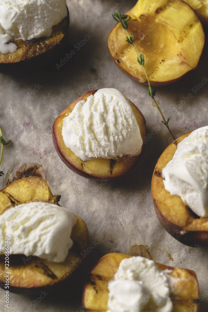 Close up of grilled peaches and nectarines served with vanilla ice cream Close up of grilled peaches and nectarines served with vanilla ice cream