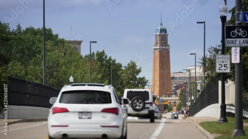A long establishing shot of traffic and pedestrians along Abbey Avenue in Cleveland, Ohio with the West Side Market tower in the distance.  	 photo