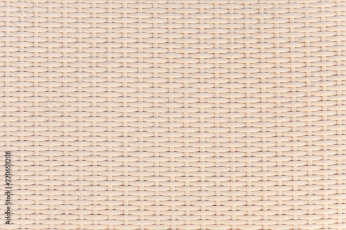 Light beige surface of woven bamboo. Background image, texture.