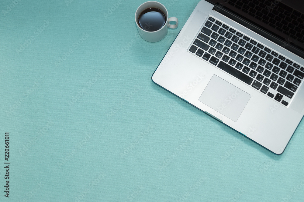 Office view. Notepad mock up. Keyboard with notebook. Laptop with coffee and pad. Modern background. Office view. Notepad mock up. Keyboard with notebook. Laptop with coffee and pad. Modern background.