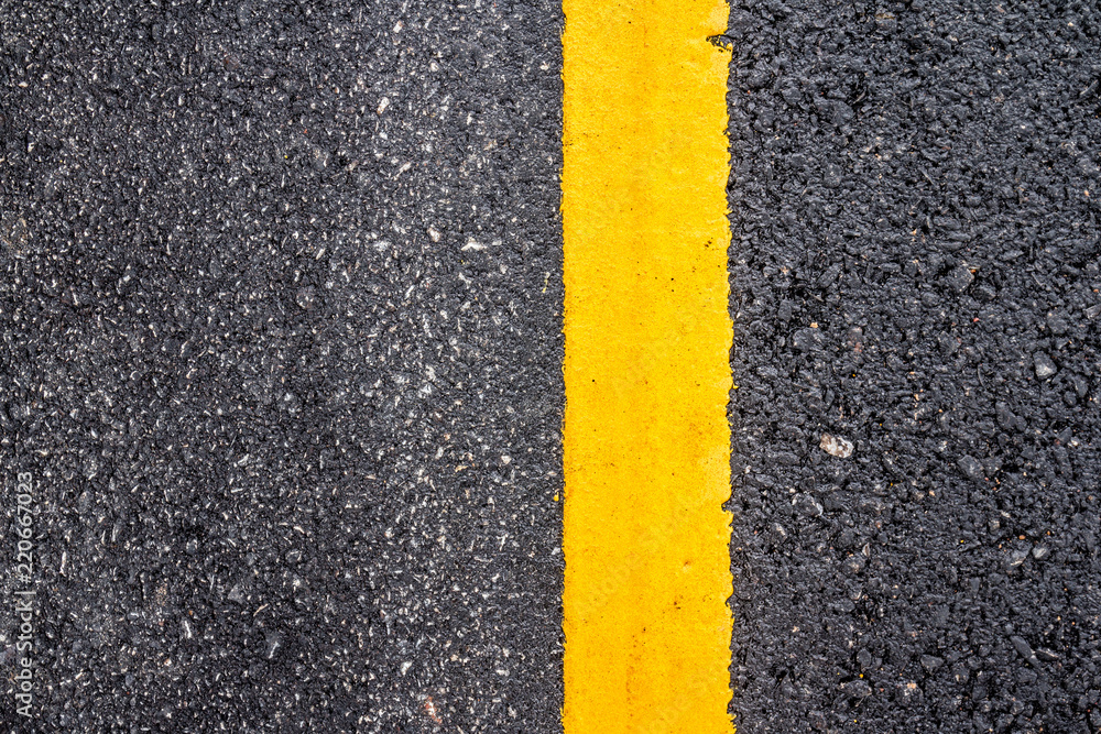 Fototapeta premium Asphalt road surface with yellow line