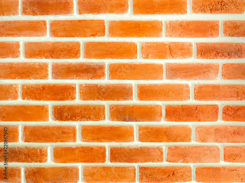 An orange sorizontan brick wall background.