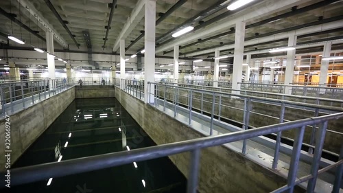 Pools with standing water in production. Placing a water treatment plant during operation photo