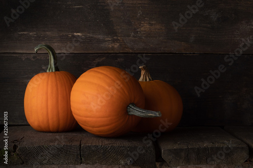 Pumpkins on wooden background