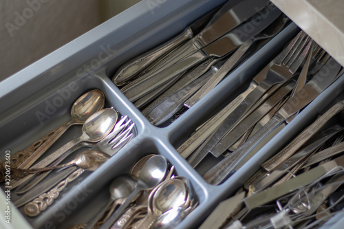 View inside an open cutlery drawer