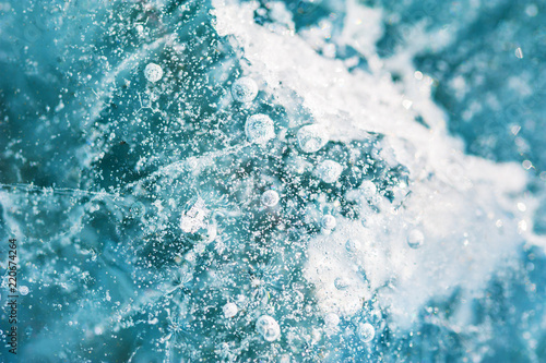 Blue ice on the frozen lake. Macro image, shallow depth of field © smallredgirl