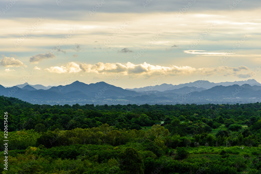 Fototapeta premium Landscape of cloudy, mountain and forest with sunset in the evening from top view.