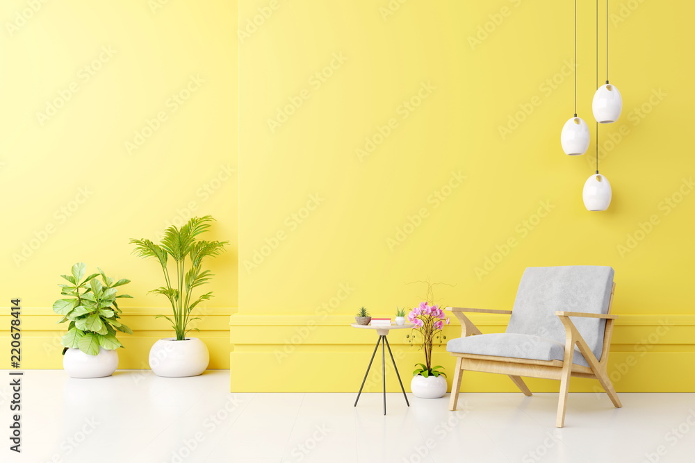 Living room interior with fabric armchair ,lamp,book and plants on empty yellow wall background.3d rendering Living room interior with fabric armchair ,lamp,book and plants on empty yellow wall background.3d rendering