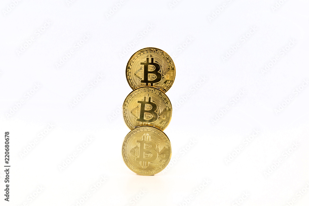 Three Bitcoin tokens stacked isolated on white background. Cryptocurrency concept with copy space.