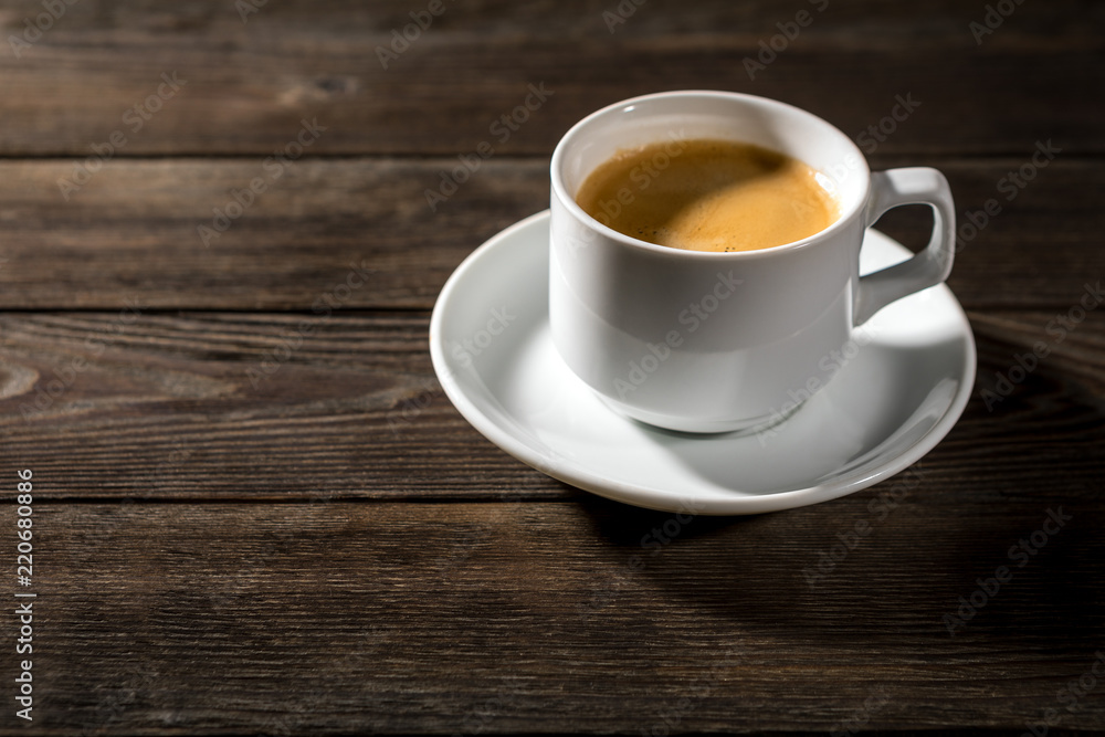 Black coffee in white cup on black wood background Black coffee in white cup on black wood background