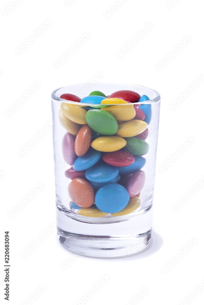 Multicoloured sweets in a little glass. Isolated object Multicoloured sweets in a little glass. Isolated object