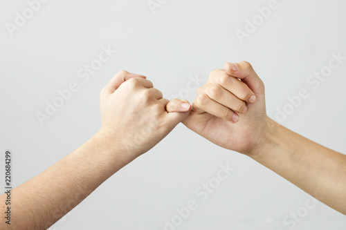 The gesture of the hands mean promise photo
