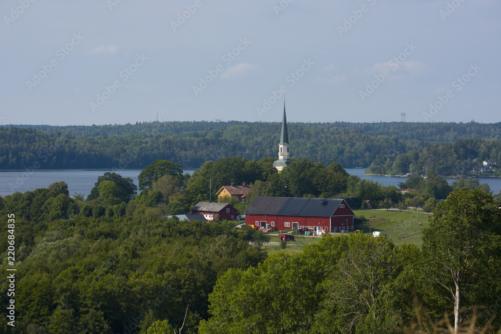 Fototapeta premium Ekerö church partly from 1200s located at the lake Mälaren in Stockholm