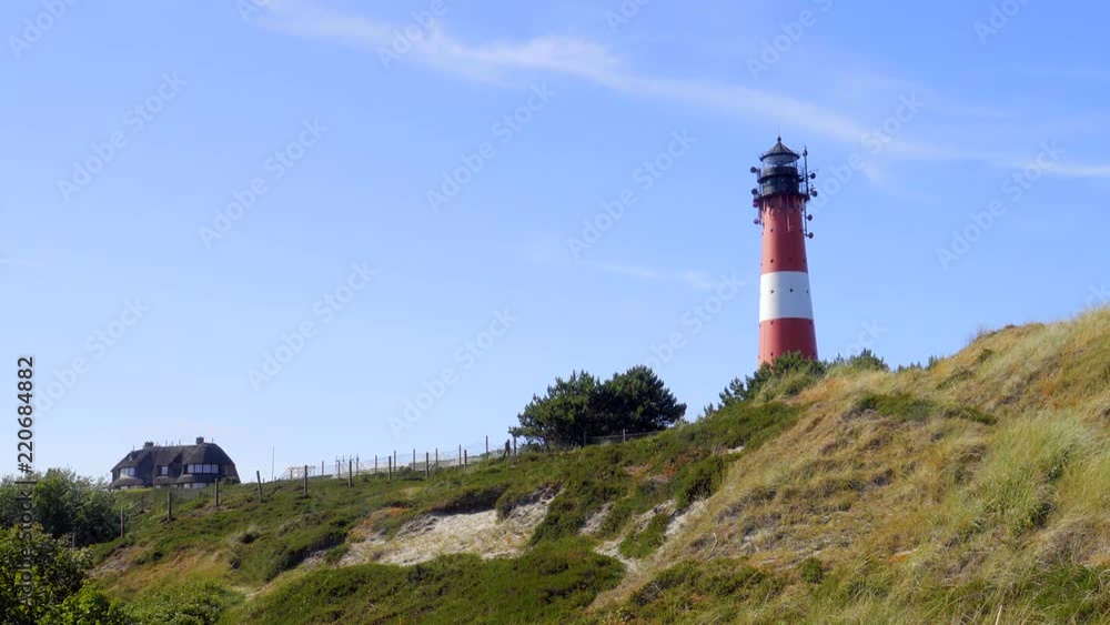 Wunderschöner Leuchtturm Hörnum Sylt mit Dünen Landschaft und blauen Himmel
Wunderschöner Leuchtturm Hörnum Sylt mit Dünen Landschaft und blauen Himmel
