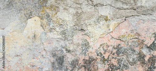 Textured grunge background. Old plastered wall with a multilayer cracked coating. Grunge texture with a deep pattern on the wall © vejaa