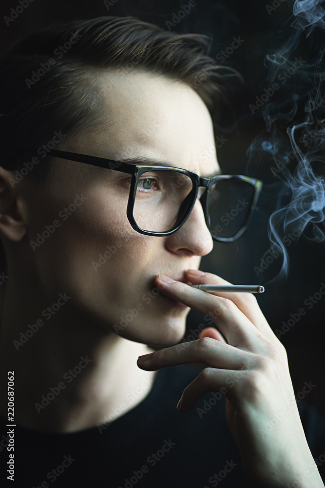 Fototapeta premium smoking young man