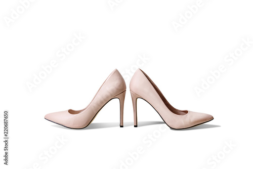 Pink, beige High heels isolated on white background, cut out from the background. Different colors of shoes, high heels arranged in a row. The concept of buying new shoes, lifestyle of a woman.
