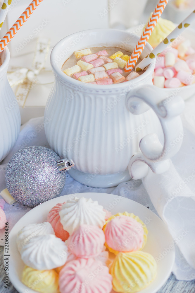 Cup of cacao with marshmallow, meringues and different Christmas decorations Cup of cacao with marshmallow, meringues and different Christmas decorations