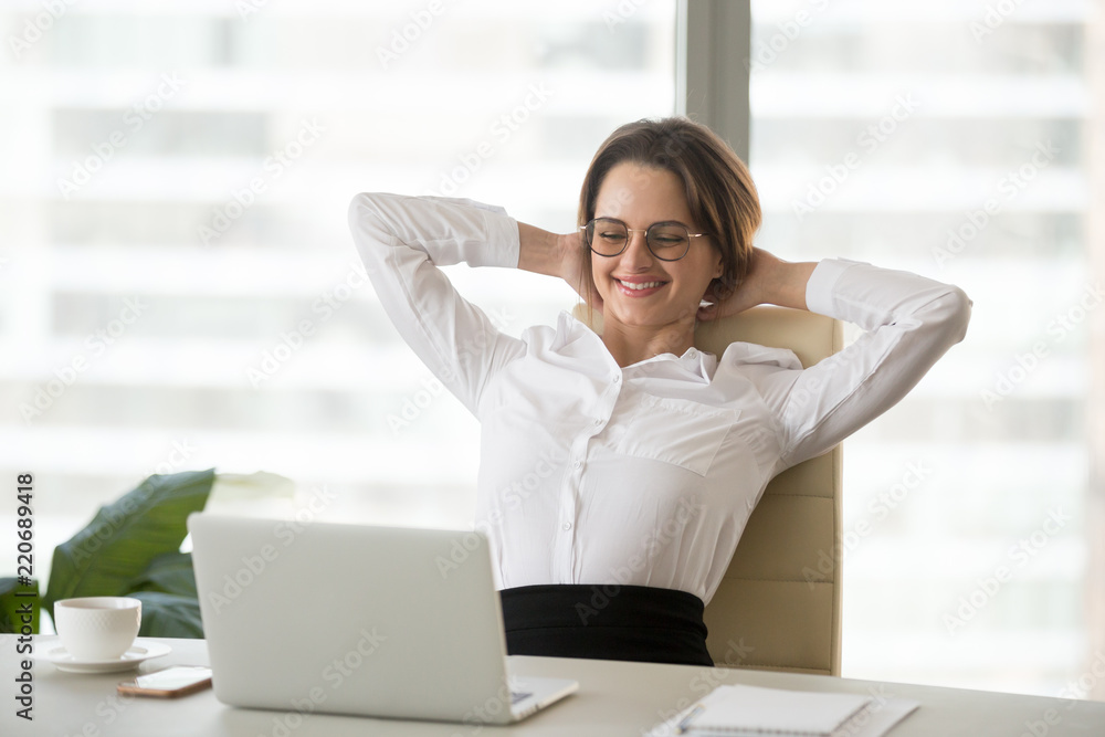 Smiling relaxed businesswoman watching funny online video at break, happy office employee worker enjoying good news in email letter feeling excited with great work result enjoying no stress free job Stock Photo | Smiling relaxed businesswoman watching funny online video at break, happy office employee worker enjoying good news in email letter feeling excited with great work result enjoying no stress free job Stock Photo |